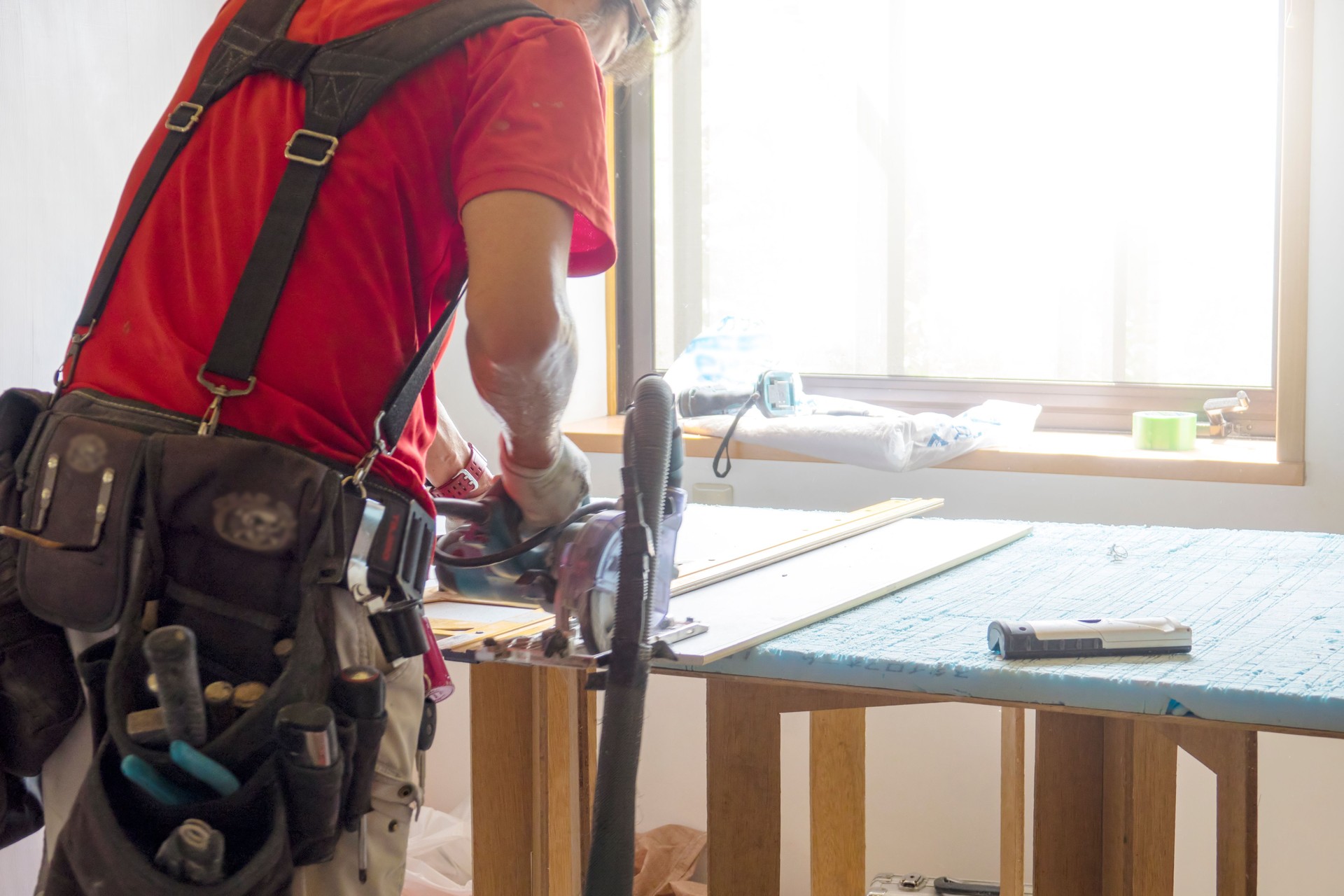 Construction worker remodeling home